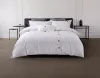 Lenjerie de pat Atria Serena, 4 piese, 100% bumbac satinat TC300, cearceaf 220x240 cm, husa pilota 180x200 cm, 2 fete perna 50x70+5 cm, broderie geometrica, alb